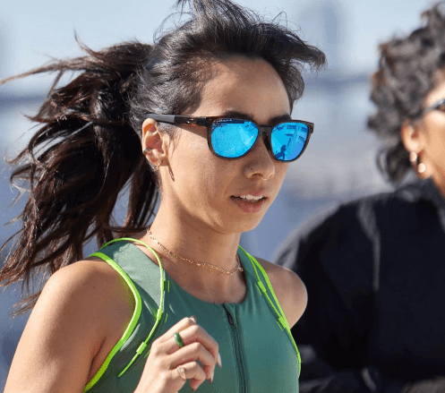 Girl Wear A Blue Sun Glasses During Run Competition